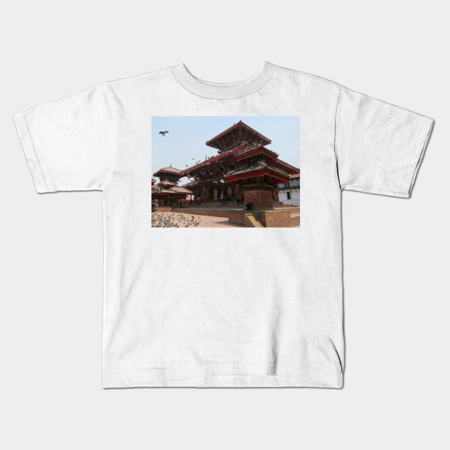 Kathmandu Temple Pigeons Kids T-Shirt by JohnDalkin